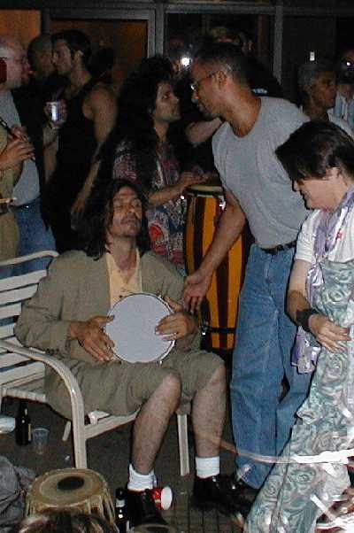 Richard urges Jason to join the dancing.